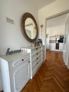 a room with a white dresser and a mirror at Matija in Gospić