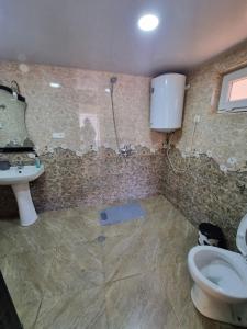 Vannituba majutusasutuses Guest House Balda