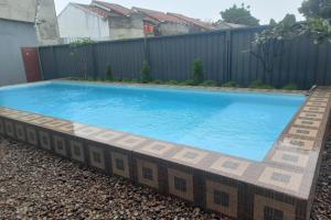 The swimming pool at or close to Capital O 93816 Cerry Village