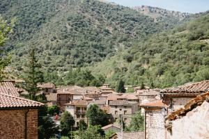 a village in front of a mountain at Casa Montero in Viniegra de Abajo