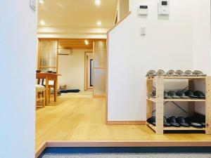a room with a shelf with dumbbells on it at Meet Inari in Kyoto