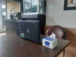 a laptop computer sitting on top of a table at OYO 93860 Wonosobo Bunkbed in Wonosobo