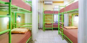 a room with four bunk beds in a dorm at OYO 93860 Wonosobo Bunkbed in Wonosobo
