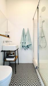 a bathroom with a sink and a shower at Jardin Rooms in Split