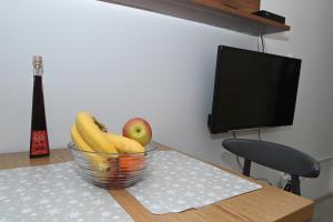 TV a/nebo společenská místnost v ubytování Apartment Oscar