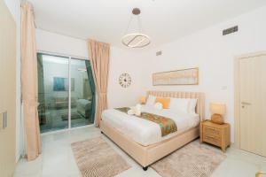 a bedroom with a bed and a sliding glass door at Dubai Marina - 1BHK Apartment in Dubai +40 photos