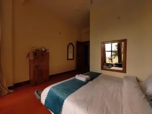 Postel nebo postele na pokoji v ubytování TSUKIMI Homestay, Naggar, Manali