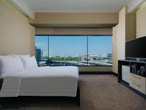 Posteľ alebo postele v izbe v ubytovaní Manhattan Hotel Jakarta