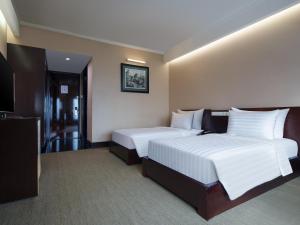 Posteľ alebo postele v izbe v ubytovaní Manhattan Hotel Jakarta