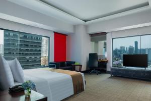 Ένα ή περισσότερα κρεβάτια σε δωμάτιο στο Manhattan Hotel Jakarta
