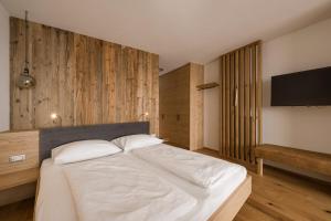 Postel nebo postele na pokoji v ubytování Hotel & Residence Rebhof