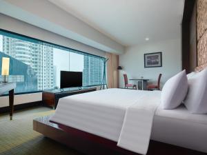 Posteľ alebo postele v izbe v ubytovaní Manhattan Hotel Jakarta