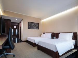 Posteľ alebo postele v izbe v ubytovaní Manhattan Hotel Jakarta