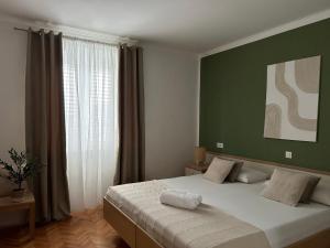 Postel nebo postele na pokoji v ubytování Perina Apartment - free parking