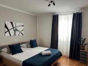 Postel nebo postele na pokoji v ubytování Perina Apartment - free parking