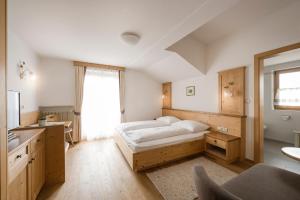 Postel nebo postele na pokoji v ubytování Hotel & Residence Rebhof + 37 fotografií