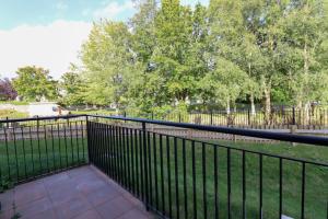 a black fence with trees in the background at Inviting 2-Bed Apartment in Dublin in Dublin +6 photos