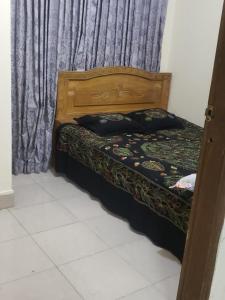 Ein Bett oder Betten in einem Zimmer der Unterkunft Lovely two bed flats by Dhaka Shahjalal Airport