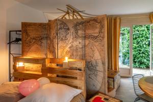 Voodi või voodid majutusasutuse Au Calme Absolu chez Elodie & Aurélien toas