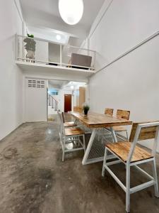 a dining room with a table and chairs at Sabay Home in Bangkok