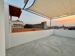 a balcony with a view of a city at Sabay Home in Bangkok