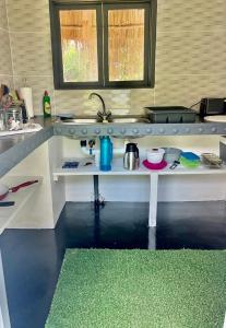 a toy kitchen with a counter and a sink at Gecko Lodge, Dolphin Cottage in Vilanculos