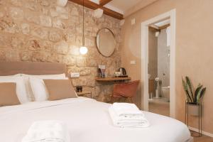 Ein Bett oder Betten in einem Zimmer der Unterkunft Mascheroni Luxury Rooms
