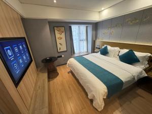 Ένα ή περισσότερα κρεβάτια σε δωμάτιο στο Orange Tree International Hotel Zhujiang New Town Huacheng Sqaure Branch - Free Shuttle Bus to Canton Fair Complex During Canton Fair Period