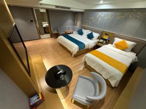 Ένα ή περισσότερα κρεβάτια σε δωμάτιο στο Orange Tree International Hotel Zhujiang New Town Huacheng Sqaure Branch - Free Shuttle Bus to Canton Fair Complex During Canton Fair Period