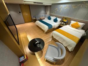 Ένα ή περισσότερα κρεβάτια σε δωμάτιο στο Orange Tree International Hotel Zhujiang New Town Huacheng Sqaure Branch - Free Shuttle Bus to Canton Fair Complex During Canton Fair Period