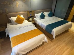 Ένα ή περισσότερα κρεβάτια σε δωμάτιο στο Orange Tree International Hotel Zhujiang New Town Huacheng Sqaure Branch - Free Shuttle Bus to Canton Fair Complex During Canton Fair Period