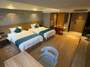 Ένα ή περισσότερα κρεβάτια σε δωμάτιο στο Orange Tree International Hotel Zhujiang New Town Huacheng Sqaure Branch - Free Shuttle Bus to Canton Fair Complex During Canton Fair Period