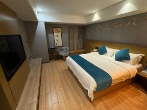 Ένα ή περισσότερα κρεβάτια σε δωμάτιο στο Orange Tree International Hotel Zhujiang New Town Huacheng Sqaure Branch - Free Shuttle Bus to Canton Fair Complex During Canton Fair Period