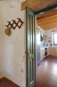 a room with a door and a kitchen with a counter at Dolly's Dream House in Patmos