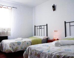 เตียงในห้องที่ Majada La Carrasca