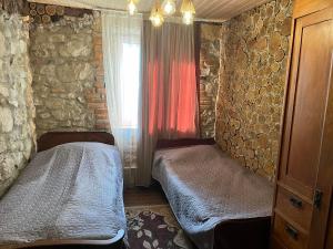 Postel nebo postele na pokoji v ubytování Guest House Giorgi & Lukas Cellar