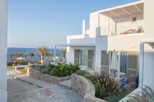 a villa with a view of the ocean at Maritimo Beach Hotel in Sissi
