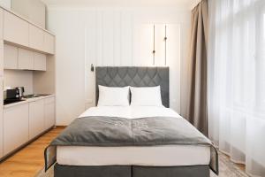 Postel nebo postele na pokoji v ubytování NOBILIS RESIDENCE