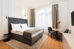 Postel nebo postele na pokoji v ubytování NOBILIS RESIDENCE