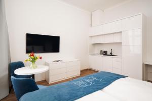 Postel nebo postele na pokoji v ubytování NOBILIS RESIDENCE