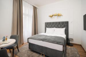 Postel nebo postele na pokoji v ubytování NOBILIS RESIDENCE