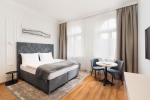 Postel nebo postele na pokoji v ubytování NOBILIS RESIDENCE