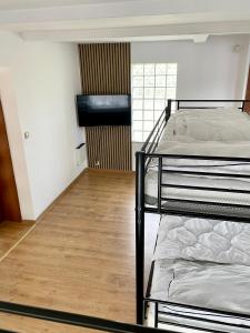Postel nebo postele na pokoji v ubytování Domek u Kacpra + 6 fotografií