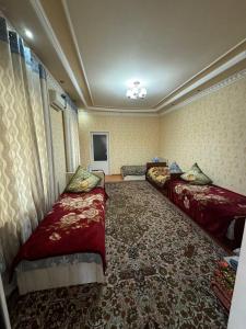 a hotel room with two beds in a room at Сабзавот Давр Дача in Yalanghoch +19 photos