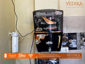 a suitcase is sitting on top of a wall at Vedika Yatri Grah - Entire Apartment in Ujjain +20 photos