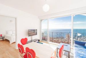 a bedroom with a view of the ocean at Stunning Sea View 1 bedroom Near Monaco in Beausoleil