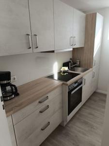 Dapur atau dapur kecil di Strandnahe Ferienwohnung