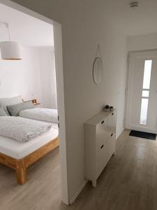 Katil atau katil-katil dalam bilik di Strandnahe Ferienwohnung