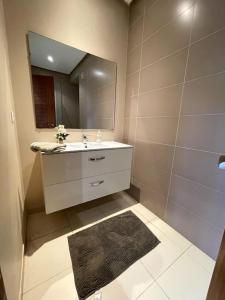 a bathroom with a sink and a mirror at BEST unit NEAR Casablanca AIRPORT in Casablanca