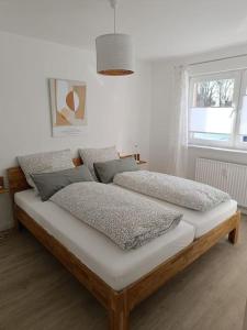 Katil atau katil-katil dalam bilik di Strandnahe Ferienwohnung